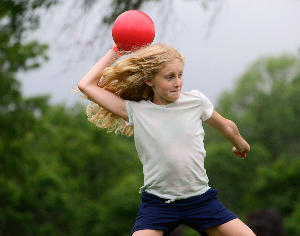 Olivia Mitchem, 9, launches her dodgeball at the opposing team